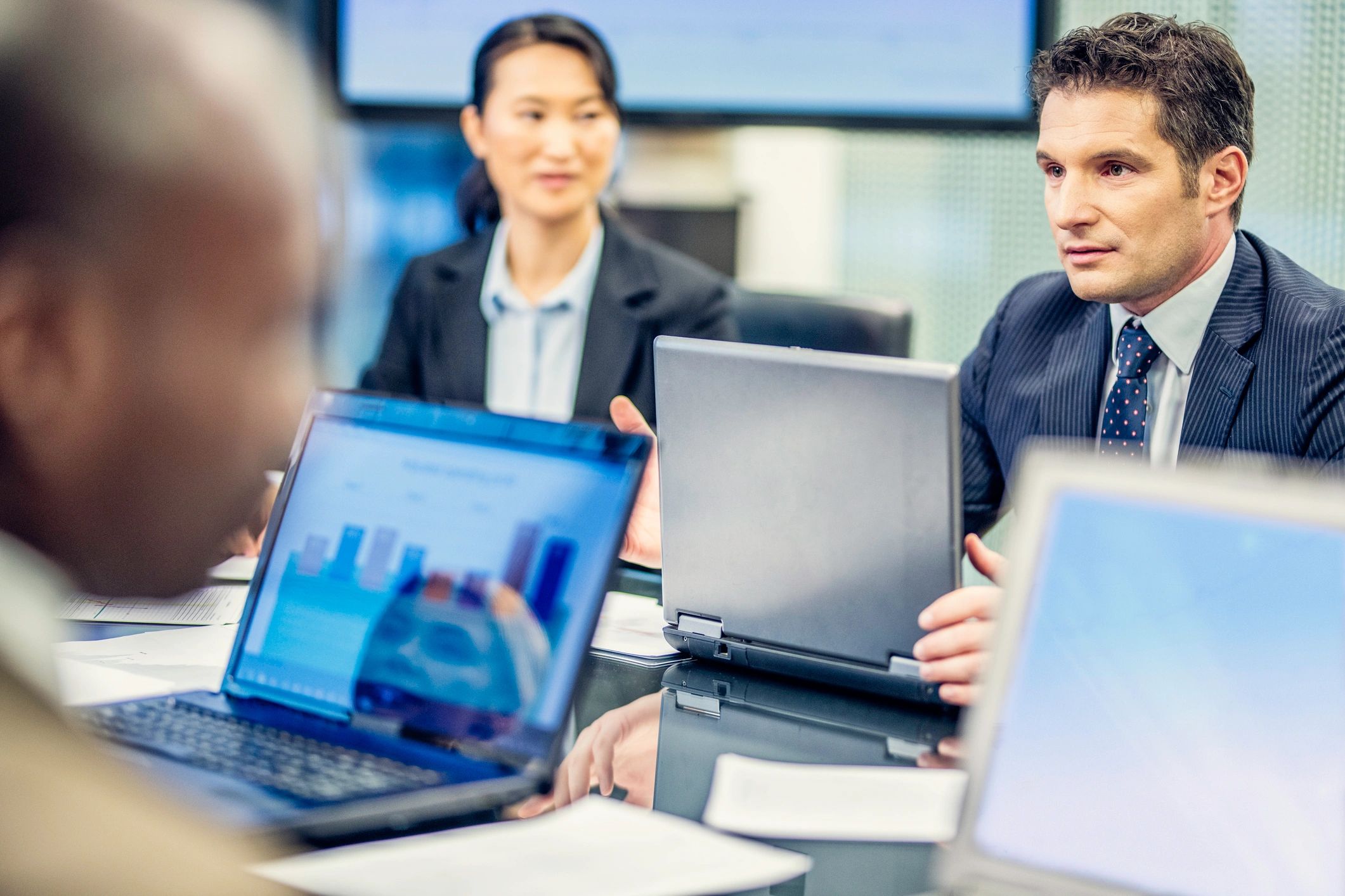 Consultants collaborating in a technology risk advisory meeting